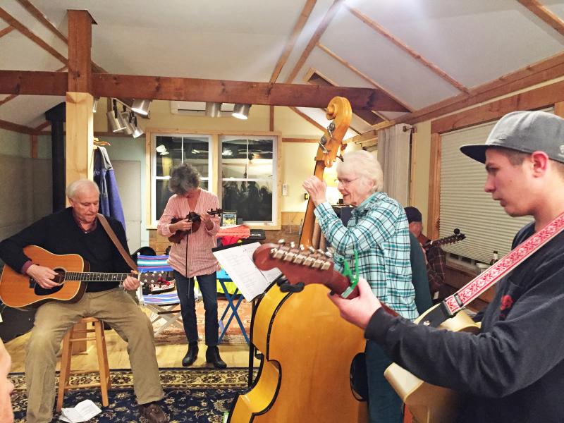Dartmouth, MA news - The Spindle Rock River Rats practicing on January 13 in manager and bass player Polly Gardner’s old barn. From left: Maury May, guest fiddle Chris Ash, Polly Gardner, and Ben Leuvelink. Photos by: Kate Robinson