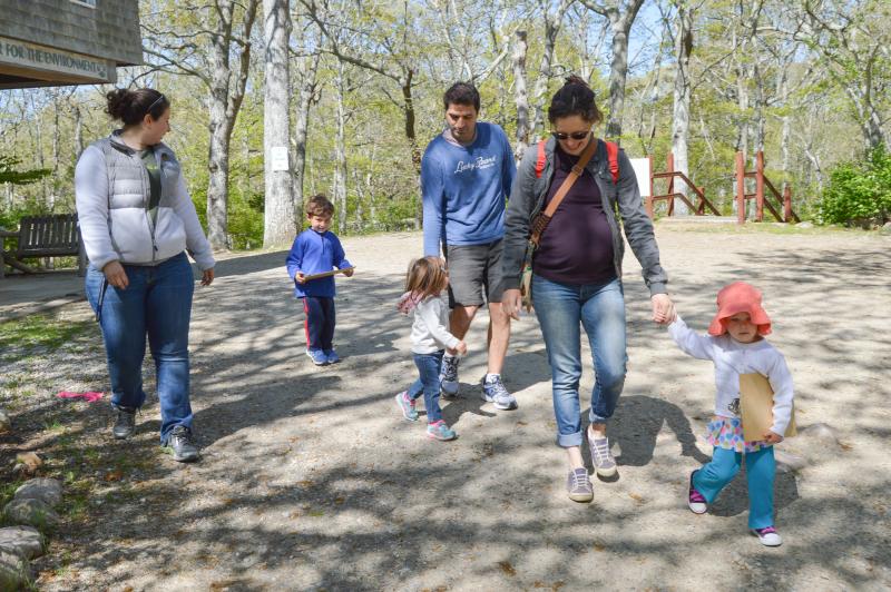 The Tot Walks crew heads out on their journey. From left to right: Jennifer Wimmer, the guide; James, 4, Adelyn, 2, and their father, Matt Brum; Jenna and her daughter, Terra Ellis, 2. BY SETH THOMAS