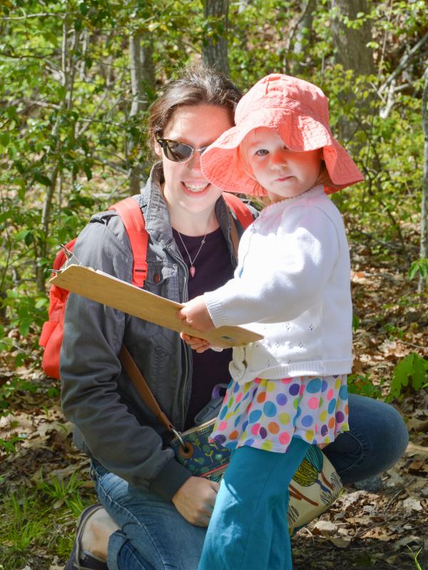 Jenna Ellis and her 2-year-old daughter, Terra, search for objects to match the colors on the Tot Walks worksheet. BY SETH THOMAS