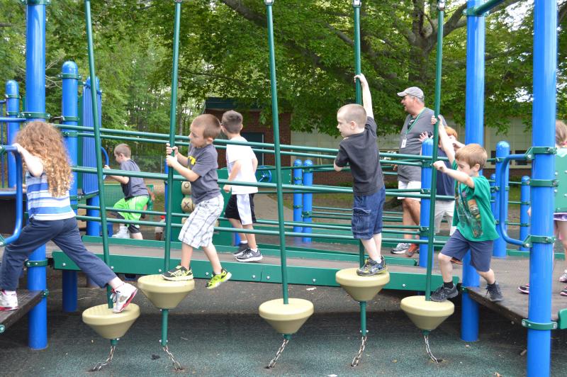 Cushman's kindergarteners visited DeMello Elementary to go over safety tips on the playground with their physical education teacher, Mickey Raposo. BY SETH THOMAS