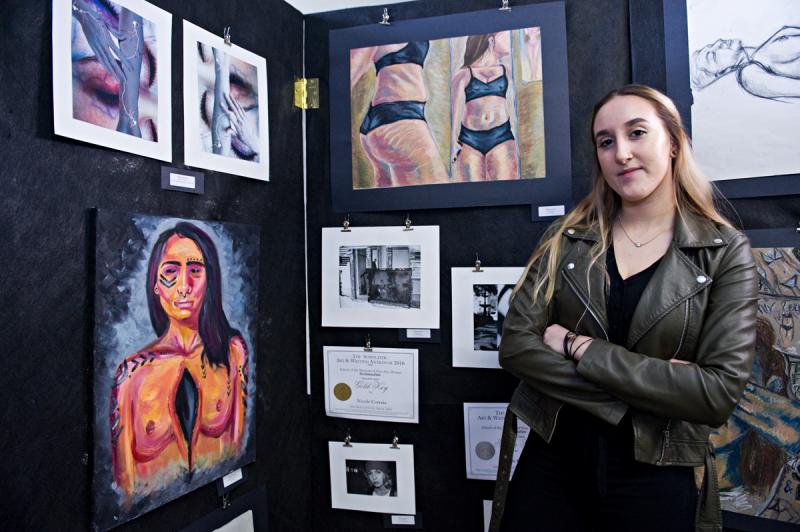 Senior Nicole Correia's art focuses on body perception and the pressure women are put under to be thin. BY DOLLY GENANNT