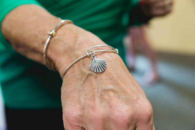 A scallop shell bracelet given to Hathaway by her son, Lucas. The scallop shell is a symbol for the Camino de Santiago. BY LAUREN ZAKNOUN
