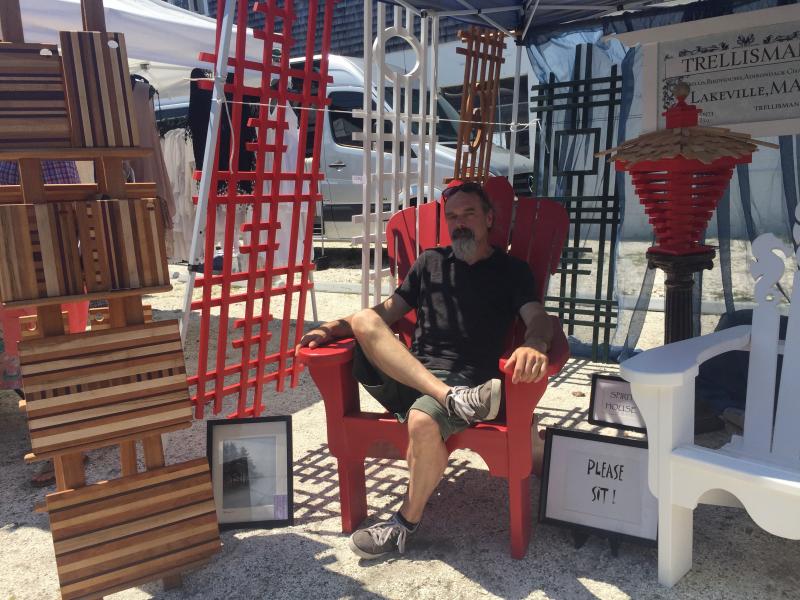 Paul Trenouth, of Trellisman, said he needs 40 hours to make two of his carved adirondack chairs. BY ANGIE HILSMAN