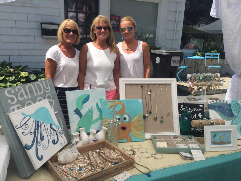 Marylou Carvalho, Roseanne Moniz, and Jennifer Roderiques work as a family to sell their crafts. Roderiques has a full room of beads in her house, she said. BY ANGIE HILSMAN