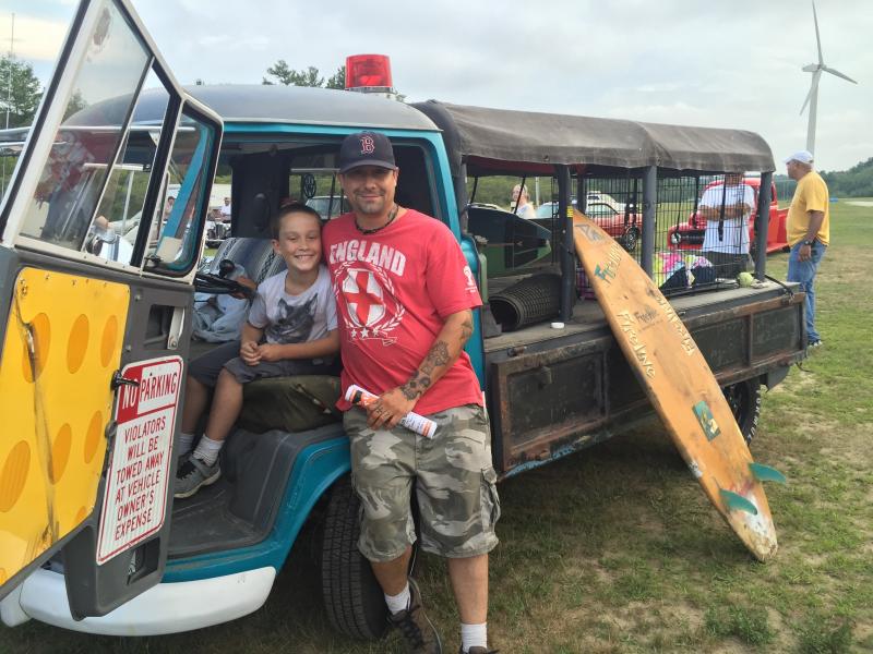 Ethan Davis's favorite car is the 1959 Volkswagon Singlecab. He stands next to it with his father Aaron Davis after checking out the vehicles at the show. BY ANGIE HILSMAN