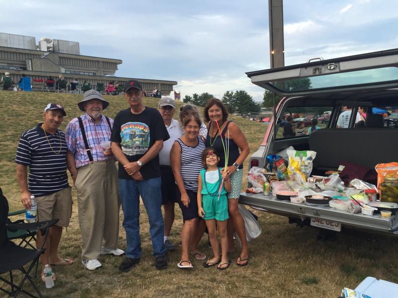 Gil Costa, Warren Hathaway, Frank Gizzi, Alan Branco, Pat Costa, Janice Branco, Marcia Hathaway, and Avery Costa tailgate on Gizzi's 1968 Chevy Suburban. BY ANGIE HILSMAN