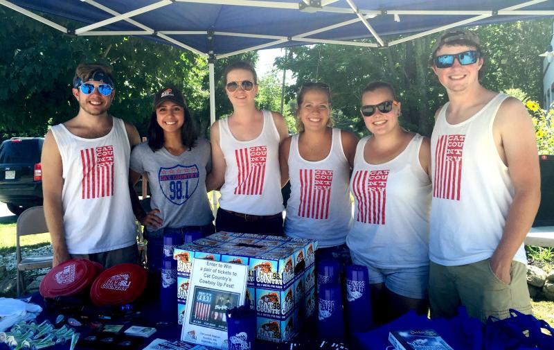 Tom Cawley, Lindsay Morrison, Michaela Burns, Danielle Bardier, Erika Bryz, and Matt Rich give away Cat Country 98.1 swag at Salvador's party. BY ANGIE HILSMAN