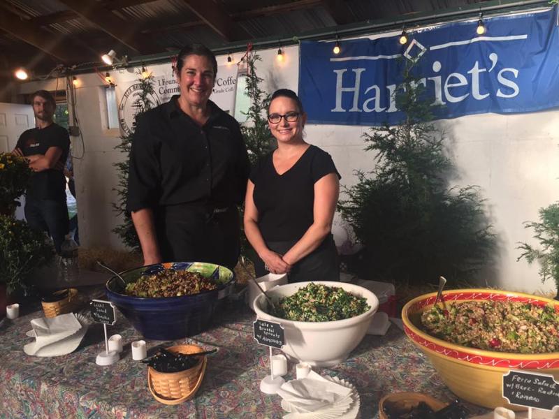Kristine Silva and Kim Tapper of Harriet's Catering serve kale brussel sprouts and lentil salad. BY ANGIE HILSMAN