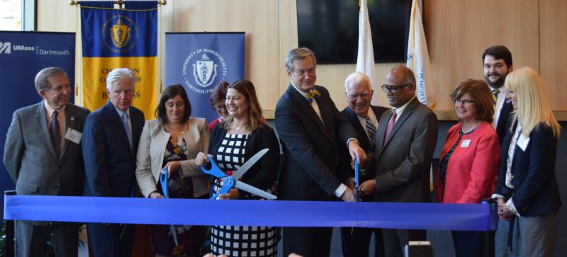 University officials, faculty, and members of the Charlton family cut the ribbon. BY DOUGLAS MCCULLOCH