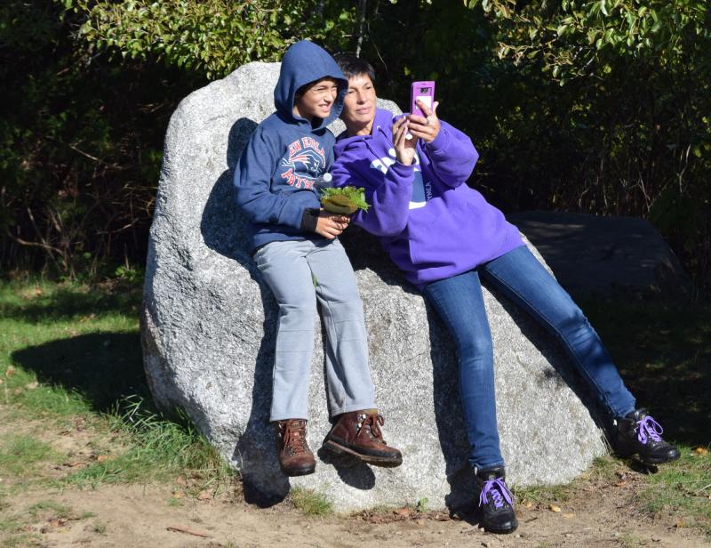 Devon and Jodi Fernandes take a selfie while sitting on a rock at Angelica's Overlook. BY DOUGLAS MCCULLOCH