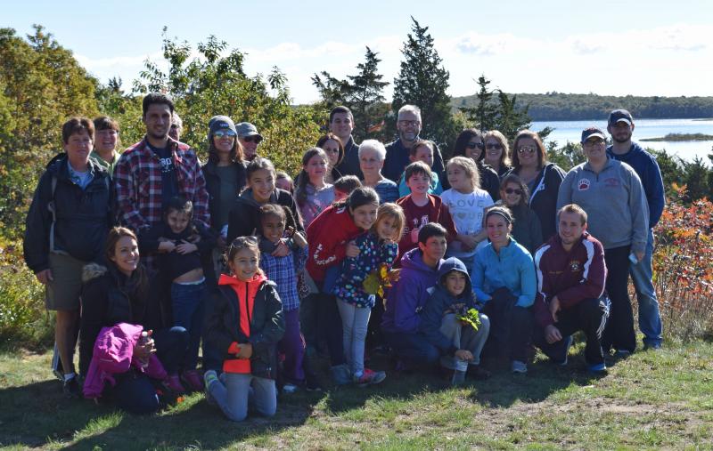 The group of DeMello Elementary School families pose at Angelica's Overlook at Slocum's River Reserve. BY DOUGLAS MCCULLOCH