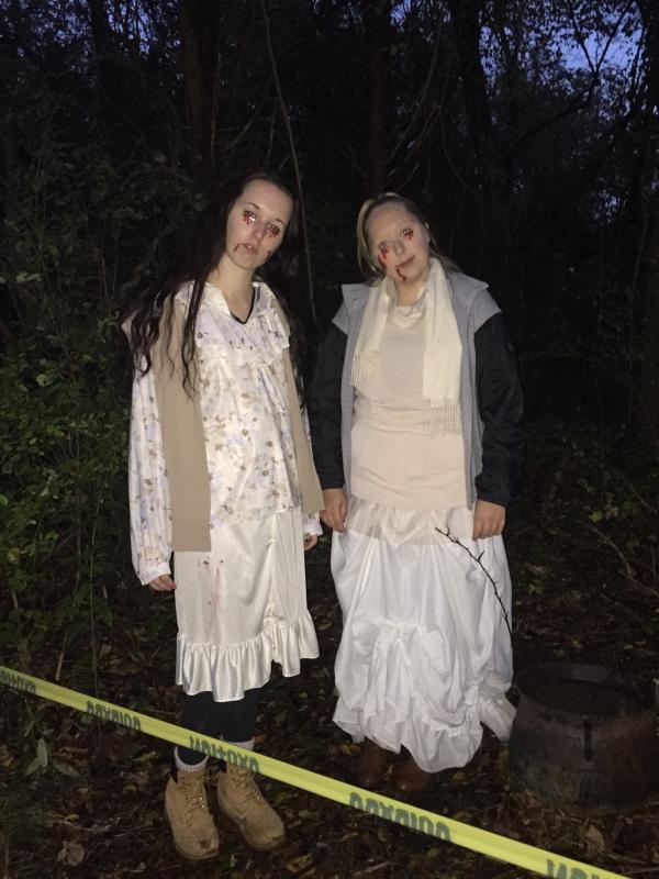 Katie Sullivan and Gabrielle Temple wear stick-on blood and sing "Ring Around the Rosie." BY ANGIE HILSMAN
