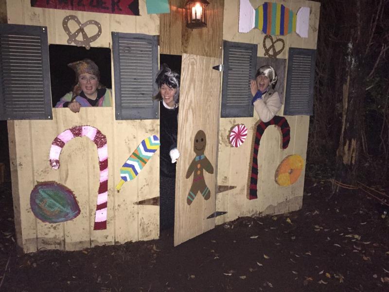 Fionna Joyce, Jen Dowling, and Kasie Costopulos invite passersby into their candy house. BY ANGIE HILSMAN