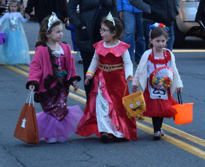 Ariane Santos, Kaelyn Braz, and Maeve Firth march down Elm Street in the first ever Padanaram Halloween Parade on October 31. Hosted by the Padanaram Business Association, the new attraction featured over 100 costumed kids and adults – and plenty of candy. BY DOUGLAS MCCULLOCH