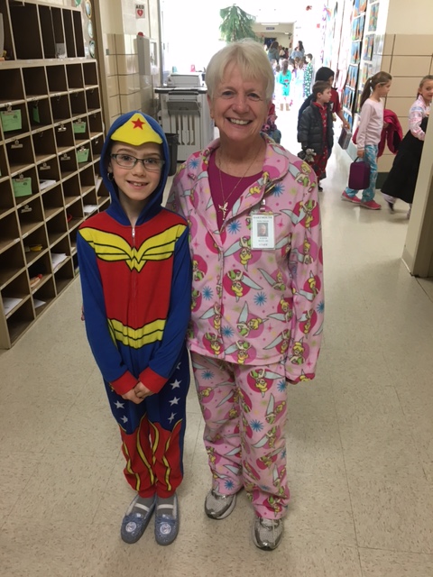 Second grader Kaylee Albernaz dressed in her Wonder Woman pajamas while hanging out with teacher assistant Judy Botelho. COURTESY RICK PORTER