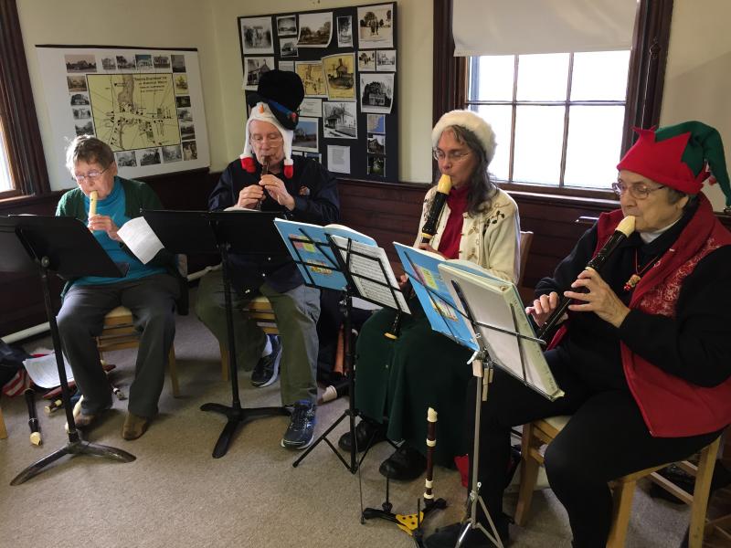 Fluters B. Brewster, Frank Fitzpatrick, Marian Ryall, and Marian Margolies play various sized recorders. BY ANGIE HILSMAN