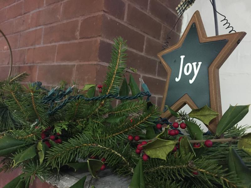 The 1871 Schoolhouse was decorated with festive trinkets, such as garland, paper snowflakes, and and ornaments. BY ANGIE HILSMAN