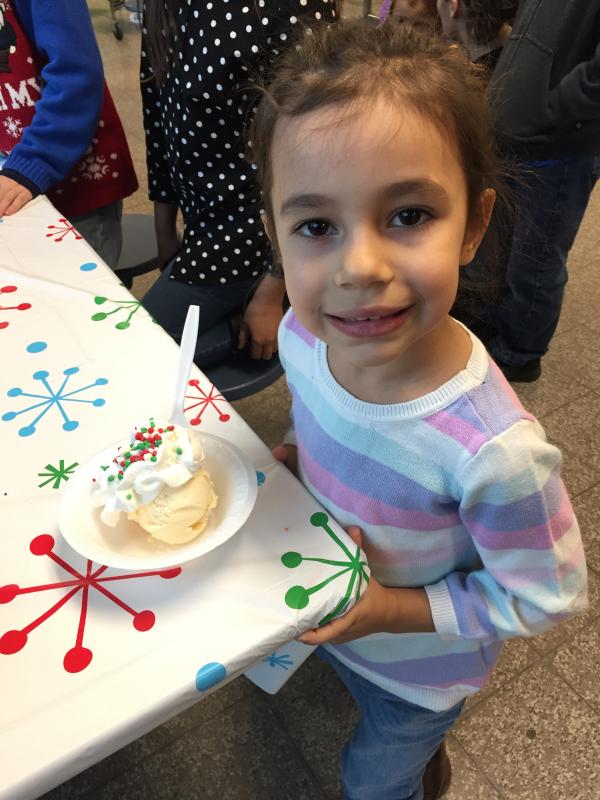 Taylor Staples, 5, decorates her ice cream sundae with Nerd candies and whipped cream. BY ANGIE HILSMAN