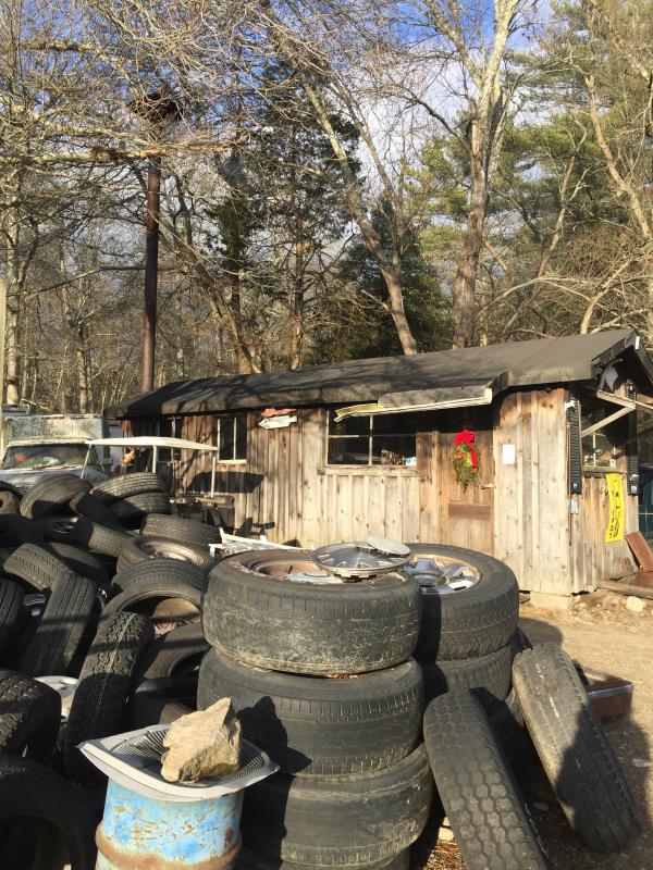 The shack serves as the office for the Croteau family. They raised its chimney stack above the trees because smoke was blowing back in through the windows. BY ANGIE HILSMAN