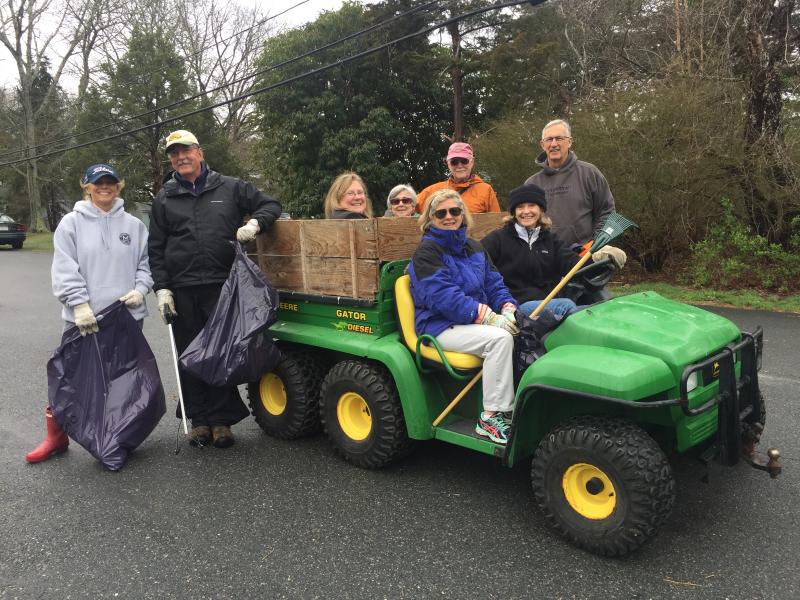 (Clockwise from left) Heather Macedo, Alan Peacock, Nancy Iuliano, Anne Kenney, Ellie Whelan, Tom Kenney, Leslie, and Gene Bergsons gather on West Smith Neck Road to clean the roadway and the waterfront. BY ANGIE HILSMAN