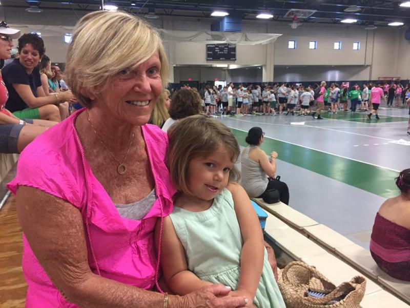 Lelah Faria and Hadley Pragana cheer on the athletes at the event's opening ceremony. BY ANGIE HILSMAN