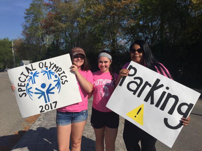 Karina Almeida, Abigail Aguiar, and Jordan McNeil direct visitors at the high school. BY ANGIE HILSMAN