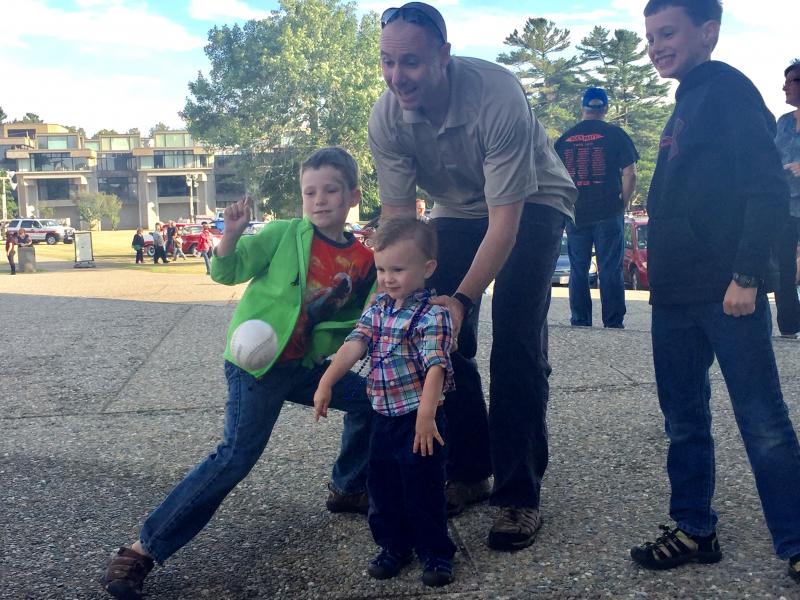 Acting Chief Brian Levesque and his childrenCameron, Aiden, and Conor play the Dunk-a-Cop game.... BY ANGIE HILSMAN