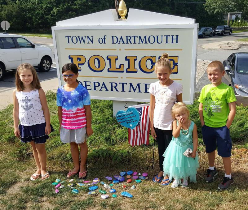 Students present the rock garden to the Dartmouth Police on August 17. COURTESY DARTMOUTH POLICE/ FACEBOOK