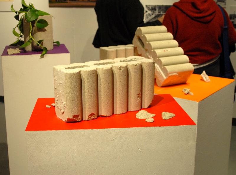 Students placed cement blocks on colored stands to show how the architecture absorbs and reflects colors. BY SHENANDOAH BRIERE