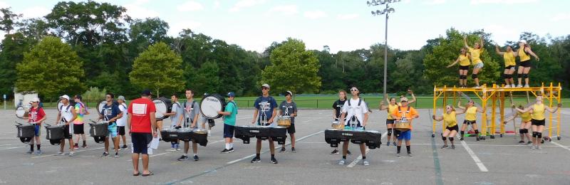 The percussion section of the band and the dancers practice a section of the show. The yellow scaffolding will be transformed into a tree supporting the dancers, dressed as birds, for the show. BY CHLOE SHELFORD