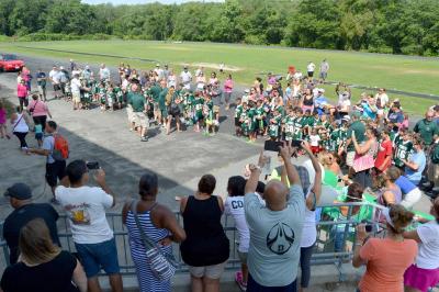 Jeff Sylvia announced the teams and parents snapped photos during the pizza party on Saturday. BY SETH THOMAS