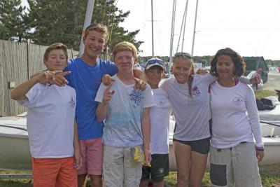 (From left) Thomas Hall of Philadelphia, Pierce Ornstein of Greenwich, Connecticut, TJ Danileck of Stamford, Connecticut, Owen Hennessey of Washington D.C., Payton Thompson of Newport Beach, California, and Marley Hillman of Washington D.C. enjoy each other's company following a day of racing. BY NICK WALECKA