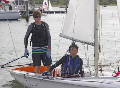 (Left) Clay Snyder and Bonito Guido, both of Miami, Florida, approach the shore after a long day of sailing. BY NICK WALECKA