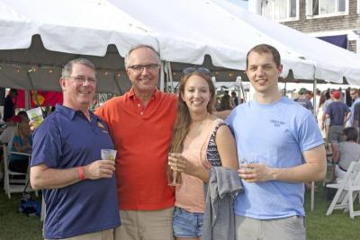 Jeff Schwarz, Albert Signorella, Jennifer Signorella, and Michael Signorella enjoy the post-racing activities. BY NICK WALECKA