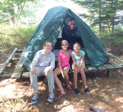 The seventh graders made it safely to Chewonki, Maine. Abby Shields, Emilia Tavares, Alyssa Farias and Xzavia Williams (rear) are all smiles. COURTESY FRIENDS ACADEMY