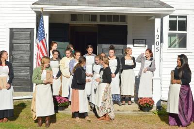 Dartmouth High school students from the early childhood education program wait for the third graders to arrive at the Russells Mills Schoolhouse. BY SETH THOMAS