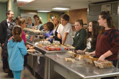 Students pitched in to help Family Fun Night run smoothly. They even helped in the cafeteria. BY SETH THOMAS