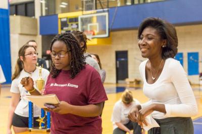 MASSPIRG Secretary Tianna Edwards (left) and Campaign Coordinator Nataki Degraffenreid (right) gave a speech about homelessness and hunger before kicking of the games. BY LAUREN ZAKNOUN