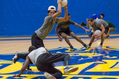 Players scramble to amass as many balls as possible at the start of the next match. BY LAUREN ZAKNOUN
