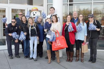 A group representing various institutions in Dartmouth greeted Letty Nelson at the Dartmouth Mall and paraded her to Macy's. BY SETH THOMAS