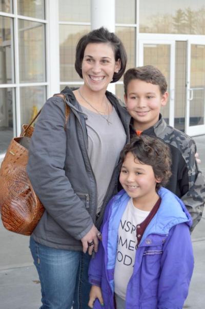 Letty was all smiles when she was greeted at the mall. From left: Kristen Nelson, Joshua Jr. Nelson, 11, and Letty Nelson, 6. BY SETH THOMAS