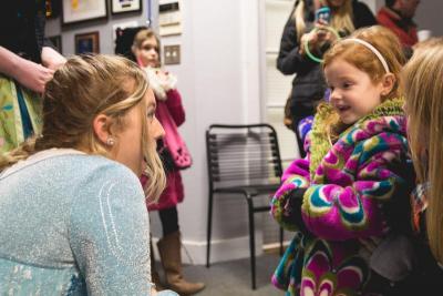 During the Padanaram Christmas Festival, a young fan is enamored by Elsa from Disney's "Frozen." BY LAUREN ZAKNOUN