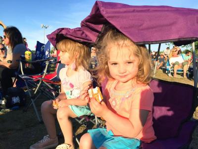 Kaitlyn Mullen, 4, and her sister Lacey, 2, enjoy the music