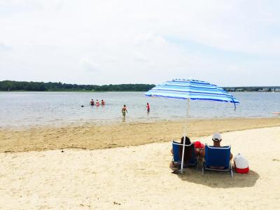 People taking advantage of the heat at Apponagansett Beach