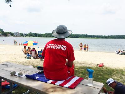 The beach lifeguard opted for a shady seat instead of one in the sun