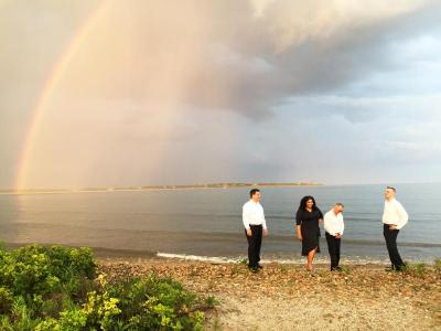 The band, Lucky 13, also took the opportunity to get a photo with the rainbow on the beach
