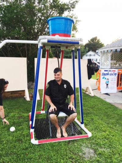 Officer Justin Medeiros nervously awaits his fate in the dunk tank