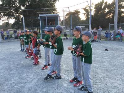 Dartmouth’s 9U team line up after winning the game 25-2