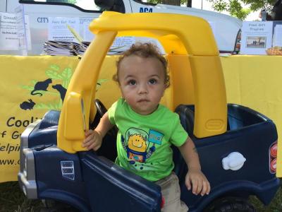 Ja’siyah Lopes, 1, playing in a toy car at the event.