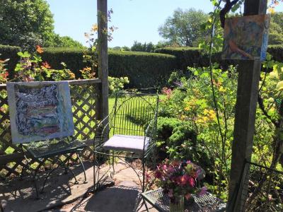 Paintings on Gillies’ garden patio during the Art Drive on August 10